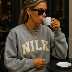 NILK heather grey crewneck sweatshirt with solid Dream Team logo, cozy women’s collegiate-style athleisure apparel