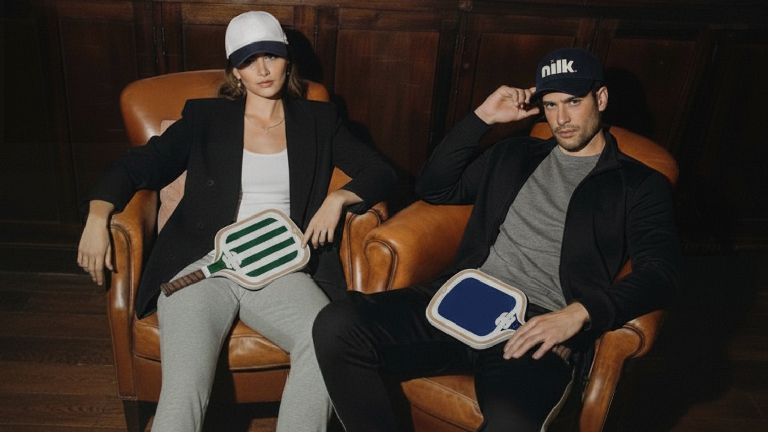 NILK pickleball paddles and apparel in a quiet luxury lifestyle setting featuring green and blue paddles.